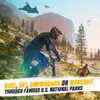 A dynamic scene depicting extreme sports in a mountainous national park setting, with text overlay promoting the game. Náhled obrázku produktu