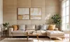 A modern living room with a sectional sofa, coffee table, and artwork on a textured wall. Anteprima dell’immagine prodotto