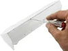 A hand is using a screwdriver to open a white electrical outlet strip. Produktbild-Vorschau
