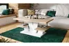 A modern living room with a couch, coffee table, and rug. Produktbild-Vorschau