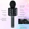 A black wireless karaoke microphone with labels pointing to its various functions and ports. Produktbild-Vorschau