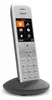 A white Gigaset cordless phone is shown in its charging cradle against a white background. Voir les images du produit