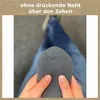 A person is holding a gray sock, showing the seam at the toe. Produktbild-Vorschau