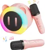 A pink karaoke machine with a microphone and colorful LED lights. Produktbild-Vorschau
