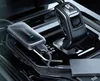 A close-up view of a car's center console, showing a car adapter plugged into the car's infotainment system. Produktbild-Vorschau