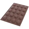 A brown silicone mold for baking madeleines in the shape of shells. Produktbild-Vorschau