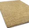 A close-up, angled view of a beige shaggy rug. Náhled obrázku produktu