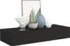 A black floating shelf with decorative items on it. Voir les images du produit
