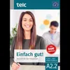 A woman is smiling and holding a pen, with another person blurred in the background. The image is for a German language learning book. Produktbild-Vorschau