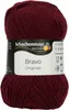 A ball of burgundy yarn with a label. Produktbild-Vorschau