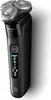 A black electric shaver with silver shaving heads is shown against a white and gray background. Náhled obrázku produktu