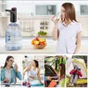 A collage of images showing a water bottle pump, a woman drinking water, a bowl of fruit, a woman working, a woman exercising, and people camping. Náhled obrázku produktu