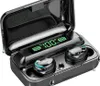 A pair of black wireless earbuds in their charging case, with water droplets on them. Náhled obrázku produktu