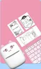 A cute cat-themed mini printer is shown with several printed sheets and a pink keyboard. Produktbild-Vorschau