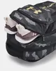 A close-up view of a backpack with shoes partially inserted into a side pocket. Náhled obrázku produktu