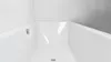 A close-up view of the interior of a white bathtub. Produktbild-Vorschau