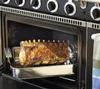 A rack of lamb is roasting in an oven. Produktbild-Vorschau