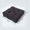 A dark gray square cushion is shown against a light gray background, with dimensions indicated by arrows and text. Náhled obrázku produktu