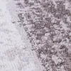 A close-up view of a textured rug with a geometric pattern. Produktbild-Vorschau