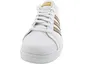 A close-up front view of a white Adidas sneaker with gold stripes. Produktbild-Vorschau