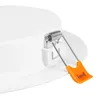 Close-up of a white LED panel light with a spring-loaded mounting clip. The clip has a silver spring and an orange plastic grip. Produktbild-Vorschau