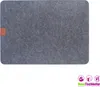 A single grey placemat with a small brown tag on the left side, presented on a white background. Produktbild-Vorschau