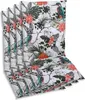 A stack of four chair cushions with a tropical bird and floral pattern. Produktbild-Vorschau