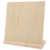 A wooden earring display stand with multiple holes for organizing earrings. Produktbild-Vorschau