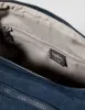 Close-up view of the interior of a blue Kipling crossbody bag, showing a zippered pocket and a brand label. Produktbild-Vorschau