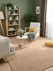 A cozy living room scene with a bookshelf, armchair, and rug. Anteprima dell’immagine prodotto