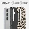 A cutaway view of a phone case showing its double-layer protection with a silicone interior and hard shell exterior, placed next to a smartphone. Produktbild-Vorschau