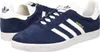 A pair of navy blue Adidas Gazelle sneakers with white stripes and soles, shown from a side-angle. Produktbild-Vorschau