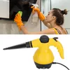 A woman cleaning a kitchen appliance with a spray bottle and cloth, and a yellow handheld steam cleaner. Náhled obrázku produktu