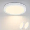 A white LED ceiling light is shown mounted on a white ceiling, with two smaller, similar lights placed on a white surface below. Náhled obrázku produktu