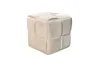 A beige cube-shaped pouf with a woven texture is shown against a white background. Produktbild-Vorschau