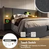 A bed with a headboard, bedside tables with charging function and reading lamps, and bedding. Náhled obrázku produktu