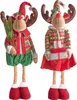 Two plush reindeer figures dressed in festive Christmas attire, standing against a white background. Náhľad obrázku produktu