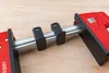 A close-up shot of a clamp on a wooden surface. Náhľad obrázku produktu