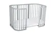 A gray crib with a white mattress inside, shown against a white background. Produktbild-Vorschau