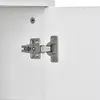 A close-up view of a cabinet hinge on a white cabinet. Podgląd zdjęcia produktu