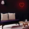 A modern living room with a purple sofa, decorative pillows, and a round wooden coffee table. Voir les images du produit