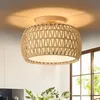 A close-up shot of a woven rattan ceiling light fixture. Produktbild-Vorschau