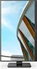 A computer monitor displaying a modern building against a blue sky. Produktbild-Vorschau