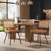A dining room setting with a wooden table and four chairs. Produktbild-Vorschau