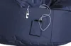 Close-up of a navy blue bean bag chair with a pocket containing a smartphone and earphones. Produktbild-Vorschau