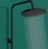 A black shower head with water flowing from it, against a green background. Produktbild-Vorschau