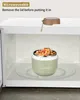 A food container inside a microwave. Produktbild-Vorschau