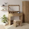 A bedroom scene featuring a vanity table with a mirror and stool, along with shelves and a wardrobe. Náhled obrázku produktu
