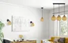 A living room with a yellow sofa, a wooden cabinet, and several lamps. Podgląd zdjęcia produktu