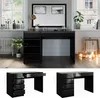A black dressing table with gold accents is shown in a room with a window and radiator. Náhled obrázku produktu
